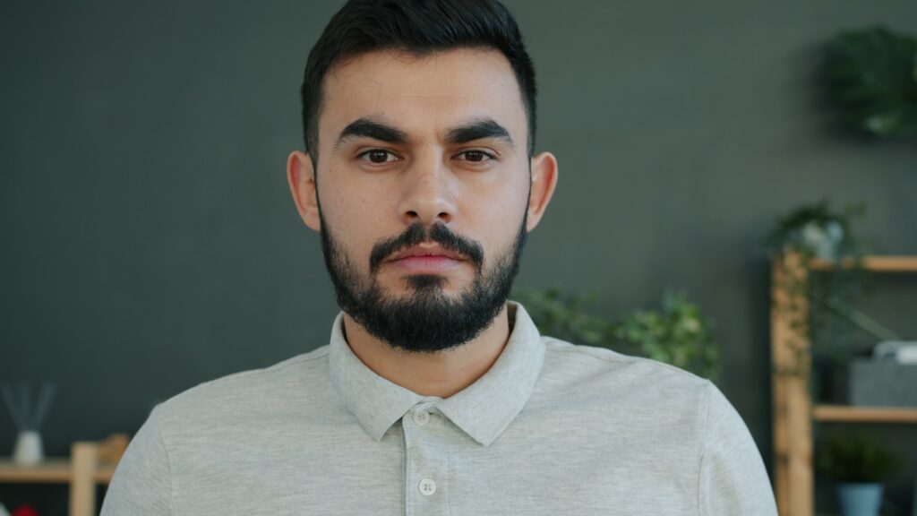 Man with beard looking directly at the camera.